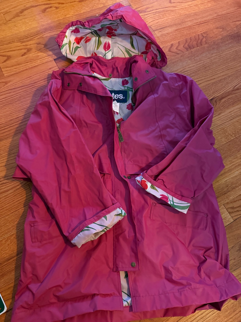 Pink Totes brand rain jacket featuring a tulip print lining